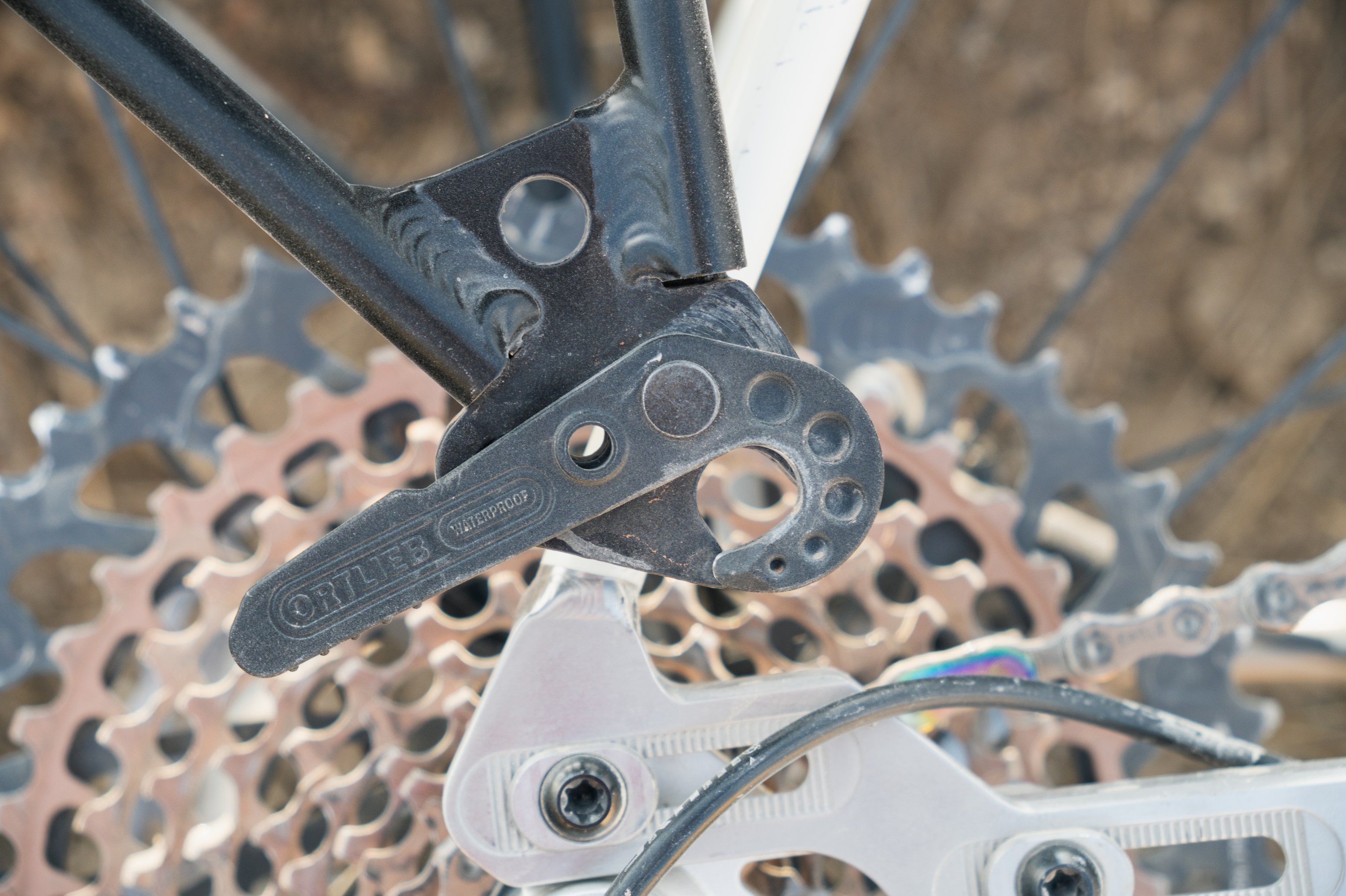 Close-up of a bicycle's rear derailleur and cassette, showcasing the components and gears.